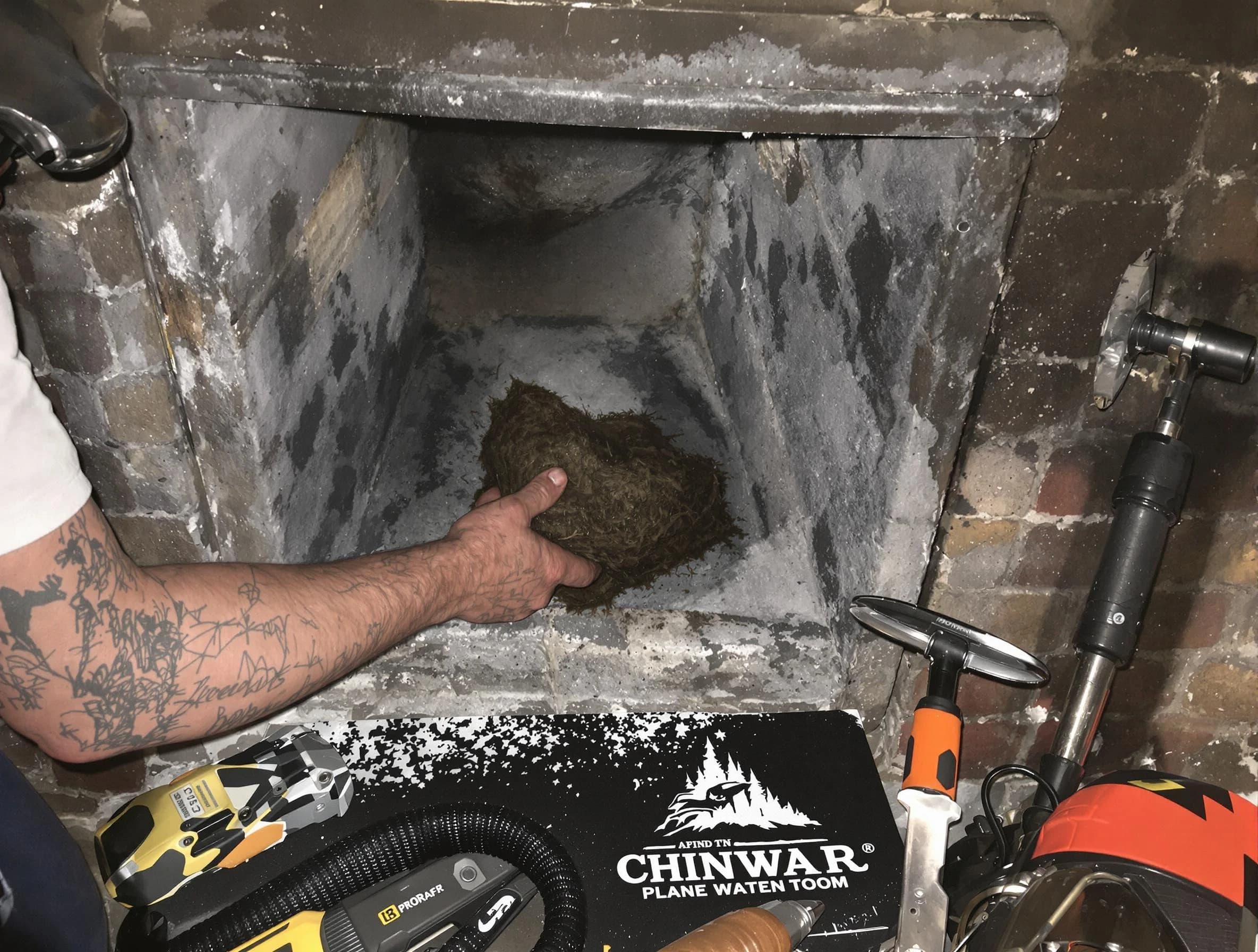 McLoud Chimney Sweep safely removing debris and screening chimney in McLoud, OK